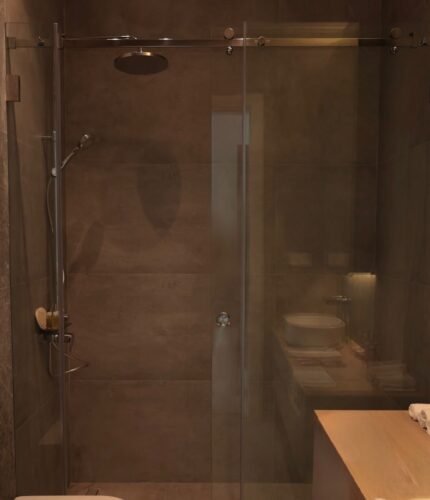 Sliding glass shower